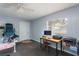 Bedroom with ceiling fan, desk, chair, and printer; room has lots of natural light at 1310 Hilton Pl, Tampa, FL 33604
