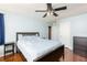 Bedroom with a queen sized bed, hardwood floors, and soft blue walls at 1310 Hilton Pl, Tampa, FL 33604