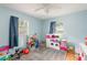 This bedroom has toys, gray carpet, natural light and blue walls at 1310 Hilton Pl, Tampa, FL 33604