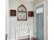 Cozy entryway with coat bench, decor, and hardwood floors at 1310 Hilton Pl, Tampa, FL 33604