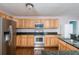 Well-equipped kitchen featuring stainless steel appliances and granite countertops at 1310 Hilton Pl, Tampa, FL 33604