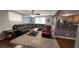 Spacious living room with a sectional sofa, a leather recliner and an adjacent kitchen area at 1310 Hilton Pl, Tampa, FL 33604