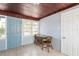 Cozy sunroom with table and chairs, wood ceilings, and tiled floors at 1310 Hilton Pl, Tampa, FL 33604
