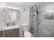 Sleek bathroom featuring modern fixtures, a glass shower, and updated vanity at 1341 Sandy Ln, Clearwater, FL 33755