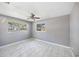 This tranquil bedroom offers ample space and natural light, enhanced by marble flooring at 1341 Sandy Ln, Clearwater, FL 33755