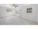 A serene living space boasting bright, natural light and marble flooring, creating an open atmosphere at 1341 Sandy Ln, Clearwater, FL 33755