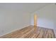 Bedroom featuring hardwood floors and neutral paint at 13703 Sweetwater Cove Pl, Tampa, FL 33613