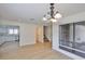 Spacious dining room with hardwood floors and access to the kitchen at 13703 Sweetwater Cove Pl, Tampa, FL 33613