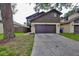 Charming two-story home featuring a spacious driveway and lovely exterior, perfect for a Gathering at 13703 Sweetwater Cove Pl, Tampa, FL 33613