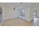 Bright living room featuring hardwood floors at 13703 Sweetwater Cove Pl, Tampa, FL 33613