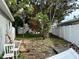 Backyard featuring a vinyl fence, mature trees, and an opportunity to create a relaxing outdoor space at 1910 New Hampshire Ne Ave, St Petersburg, FL 33703