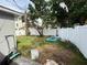 Spacious backyard featuring a vinyl fence, palm trees, and opportunity to create your dream outdoor oasis at 1910 New Hampshire Ne Ave, St Petersburg, FL 33703