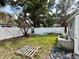 Backyard featuring a vinyl fence, palm trees, and opportunity to create your dream outdoor oasis at 1910 New Hampshire Ne Ave, St Petersburg, FL 33703
