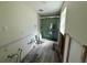 Bathroom in need of renovation featuring a glass-enclosed shower at 1910 New Hampshire Ne Ave, St Petersburg, FL 33703