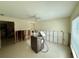 Open living room showing ceiling fan and adjacent space needing renovation at 1910 New Hampshire Ne Ave, St Petersburg, FL 33703