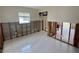 Room needing renovation with window and block wall at 1910 New Hampshire Ne Ave, St Petersburg, FL 33703