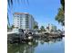 Scenic waterfront view of luxury condos and boats docked along the pier at 1910 New Hampshire Ne Ave, St Petersburg, FL 33703