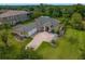 Expansive aerial view of a property showcasing its lush landscaping, spacious layout, and proximity to surrounding greenery at 19815 Sea Rider Way, Lutz, FL 33559