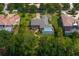 Beautiful home features a screened pool, lush landscaping, and paver driveway at 19815 Sea Rider Way, Lutz, FL 33559