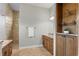 Bathroom featuring granite countertops, a walk-in shower, and built-in shelving at 19815 Sea Rider Way, Lutz, FL 33559
