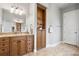 Bathroom featuring granite counters, a built-in shelving unit, and neutral tones at 19815 Sea Rider Way, Lutz, FL 33559