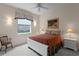 Cozy bedroom with a ceiling fan, and matching bedside lamps and nightstands at 19815 Sea Rider Way, Lutz, FL 33559