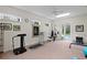 Spacious gym with plenty of equipment and natural light at 19815 Sea Rider Way, Lutz, FL 33559