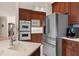 Modern kitchen with stainless steel refrigerator, double oven, and custom cabinetry at 19815 Sea Rider Way, Lutz, FL 33559