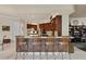 Gourmet kitchen features a breakfast bar with seating, custom cabinetry, and modern appliances at 19815 Sea Rider Way, Lutz, FL 33559