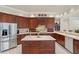 Spacious kitchen with stainless steel appliances, island with storage, and ample counter space at 19815 Sea Rider Way, Lutz, FL 33559