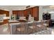 Well-appointed kitchen with custom cabinets, stainless steel appliances, and breakfast bar at 19815 Sea Rider Way, Lutz, FL 33559