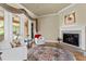 Bright living room showcasing hardwood flooring, fireplace, and french doors to the lanai at 19815 Sea Rider Way, Lutz, FL 33559