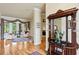 Inviting view of living room with hardwood flooring and sitting area with french doors to the lanai at 19815 Sea Rider Way, Lutz, FL 33559