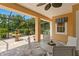 Covered patio features a stone fountain, lovely seating, and views of lush landscaping at 19815 Sea Rider Way, Lutz, FL 33559