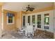 Charming covered patio features an overhead fan, and ample room for outdoor dining at 19815 Sea Rider Way, Lutz, FL 33559