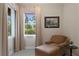 Relaxing sitting area with comfortable chaise lounge and view to the outdoors at 19815 Sea Rider Way, Lutz, FL 33559