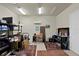 Cluttered storage room with shelving units, a TV, and a variety of household items at 19815 Sea Rider Way, Lutz, FL 33559
