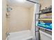 Bright bathroom featuring tiled shower and bathtub at 200 Country Club Dr # 403, Largo, FL 33771