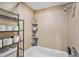Tiled bathtub and shower area in a bathroom, complete with storage shelving for toiletries at 200 Country Club Dr # 403, Largo, FL 33771