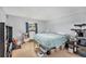 Comfortable bedroom with neutral walls, a window, cat tree and storage solutions under bed at 200 Country Club Dr # 403, Largo, FL 33771