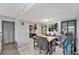 Bright dining area open to the kitchen with black cabinets and tile flooring at 200 Country Club Dr # 403, Largo, FL 33771