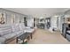 Open-concept living room and dining area with gray walls and neutral carpeting at 200 Country Club Dr # 403, Largo, FL 33771