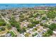 Aerial view of neighborhood by the water featuring mature trees and single-Gathering homes at 2004 Yale Ave, Dunedin, FL 34698
