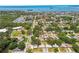 Panoramic aerial shot showcasing a neighborhood close to the bay with lots of trees at 2004 Yale Ave, Dunedin, FL 34698