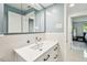 Updated bathroom vanity features a white countertop, storage, and modern fixtures at 2004 Yale Ave, Dunedin, FL 34698