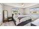 Bedroom with neutral walls, ceiling fan, and a window for ample natural light at 2004 Yale Ave, Dunedin, FL 34698