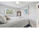 Relaxing bedroom featuring ample natural light and a calming color palette at 2004 Yale Ave, Dunedin, FL 34698