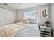Bright bedroom with cozy decor, ceiling fan, and ample natural light at 2004 Yale Ave, Dunedin, FL 34698
