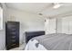 Bedroom with neutral walls, ceiling fan, closet, and dark wood furniture at 2004 Yale Ave, Dunedin, FL 34698