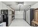 Well-organized garage with storage cabinets and epoxy flooring for added functionality at 2004 Yale Ave, Dunedin, FL 34698